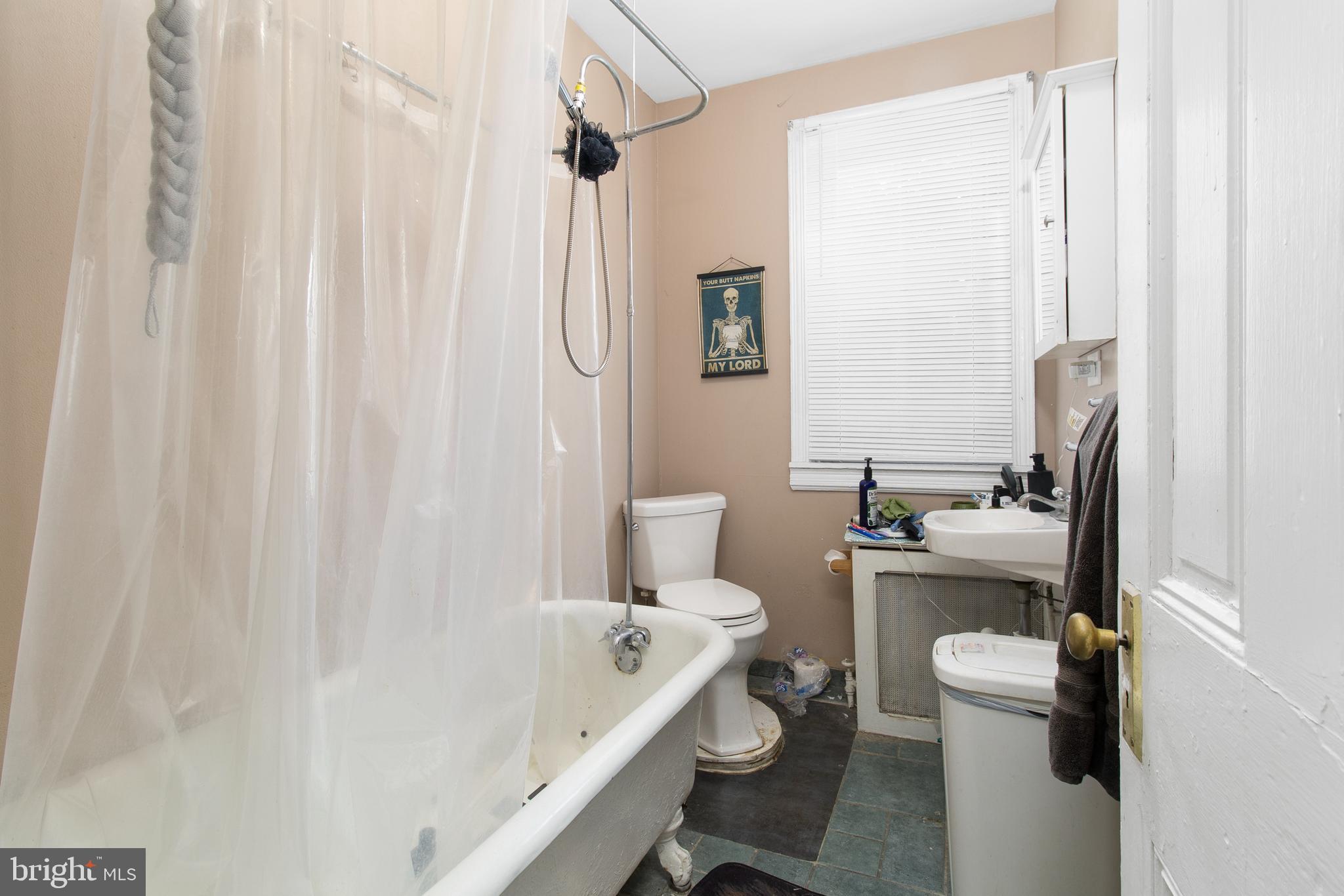 85 Madison Avenue Mount Holly, NJ 08060 - Photo 32 of 41 a bathroom with a sink a toilet and shower curtain