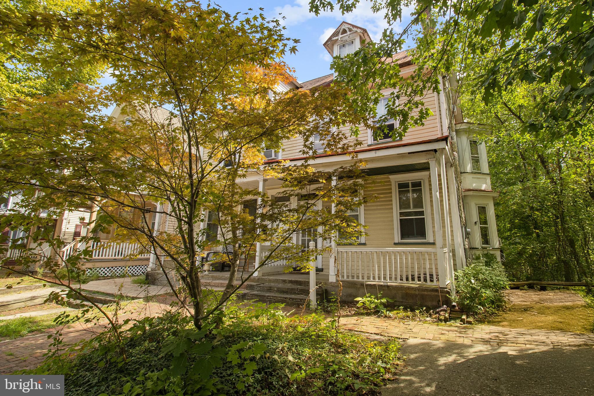 85 Madison Avenue Mount Holly, NJ 08060 - Photo 4 of 41 a view of a house with a tree in the yard