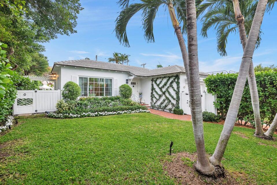 156 Peruvian Avenue Palm Beach, FL 33480 - Photo 1 of 20 a front view of a house with garden