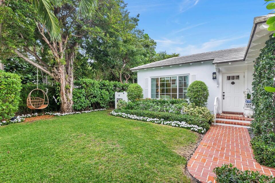 156 Peruvian Avenue Palm Beach, FL 33480 - Photo 3 of 20 a front view of a house with garden