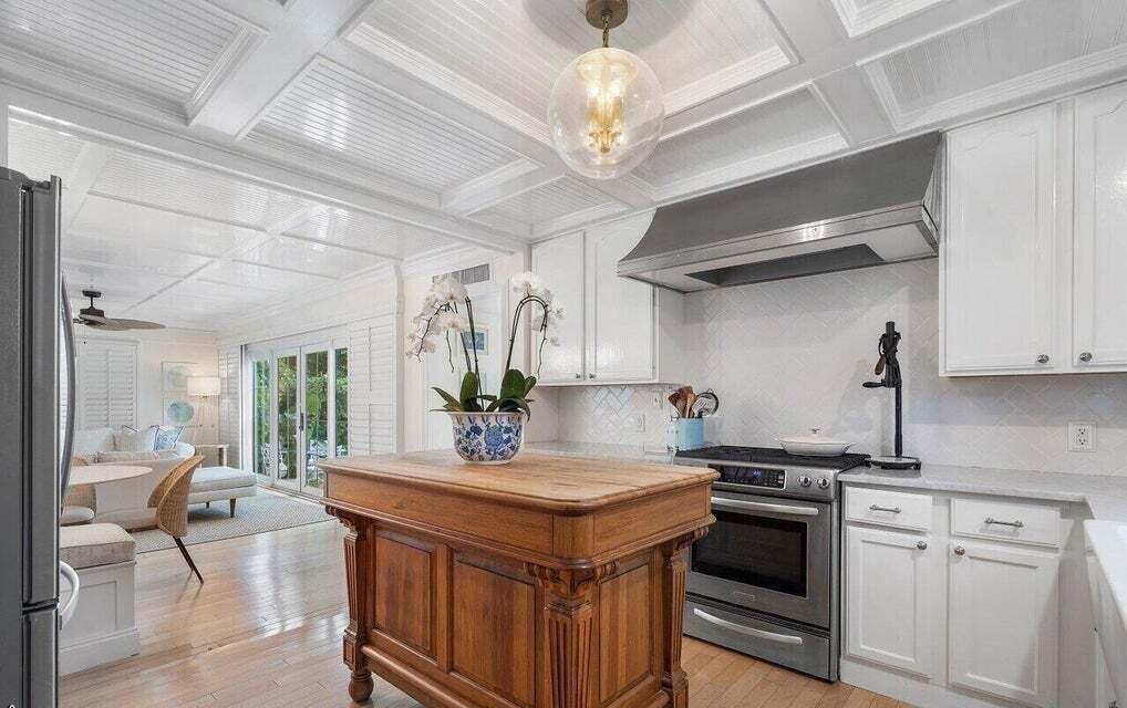 156 Peruvian Avenue Palm Beach, FL 33480 - Photo 9 of 20 a kitchen with a stove and a chandelier