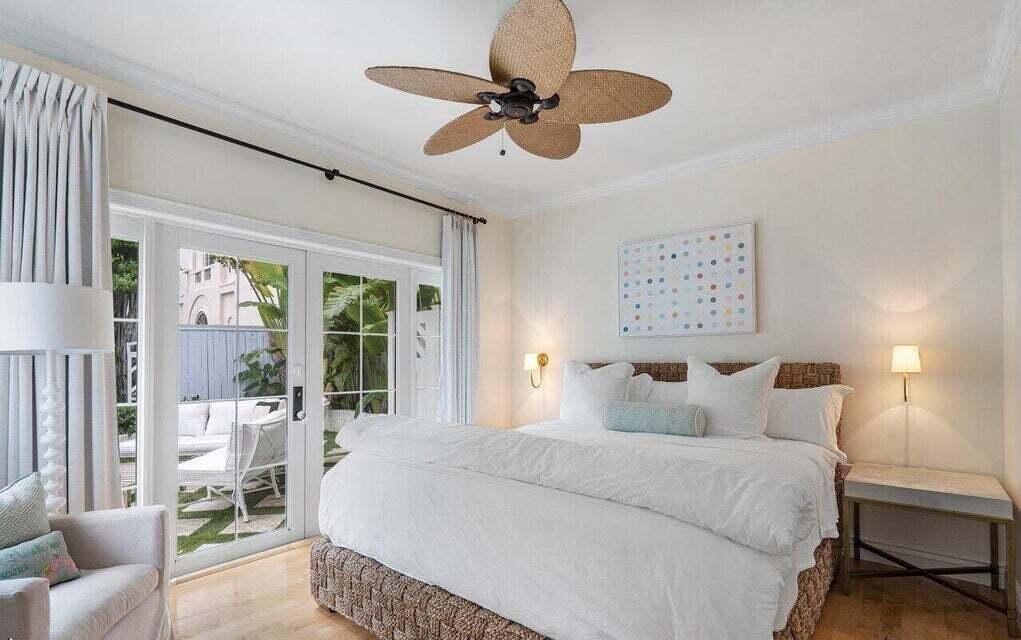 156 Peruvian Avenue Palm Beach, FL 33480 - Photo 10 of 20 a bedroom with a bed mirror and window