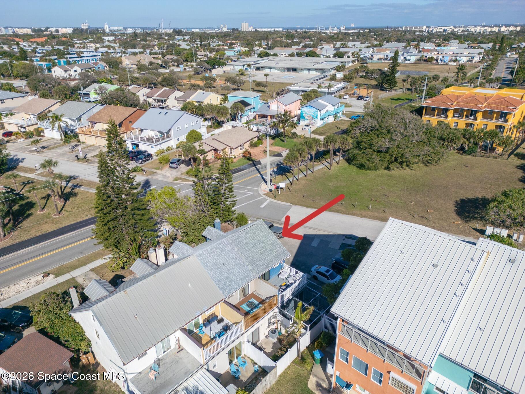 8156 Ridgewood Avenue Cape Canaveral, FL 32920 - Photo 20 of 53 an aerial view of a house with a yard