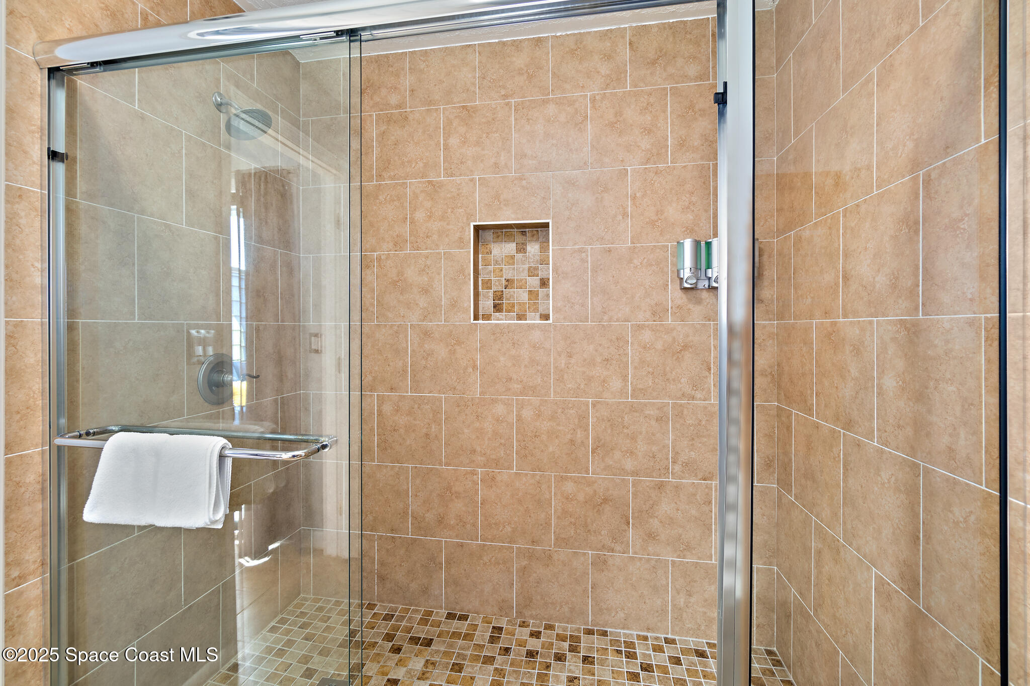 8156 Ridgewood Avenue Cape Canaveral, FL 32920 - Photo 28 of 53 a bathroom with a shower