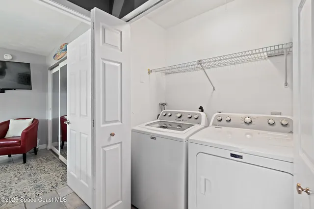 a view of a livingroom with furniture and front door