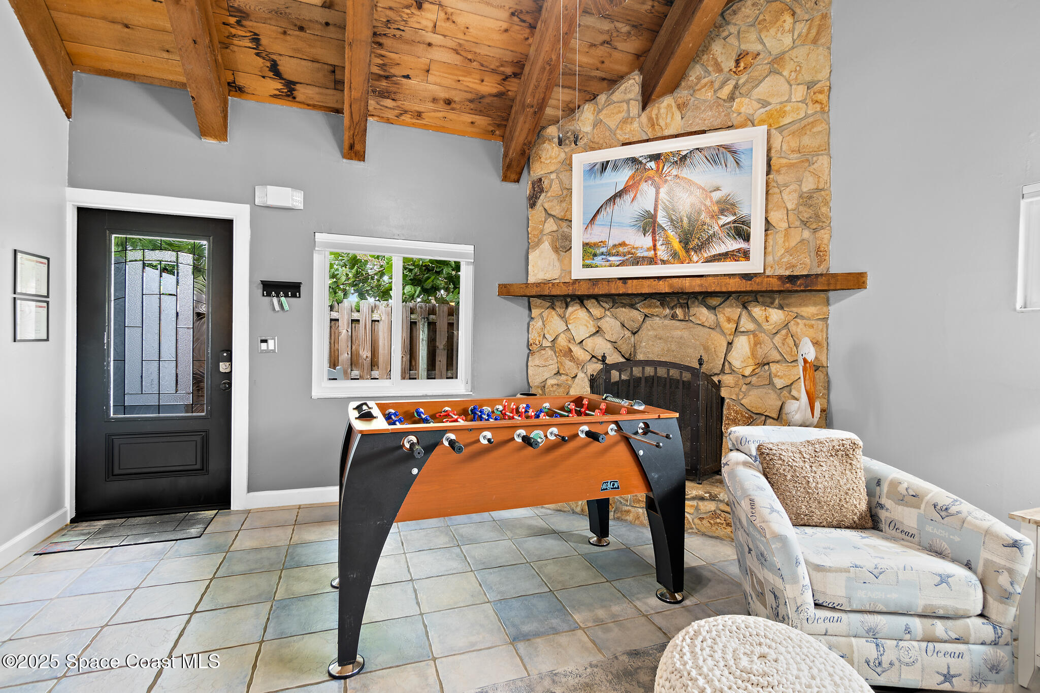 8156 Ridgewood Avenue Cape Canaveral, FL 32920 - Photo 31 of 53 a view of a livingroom with furniture and front door