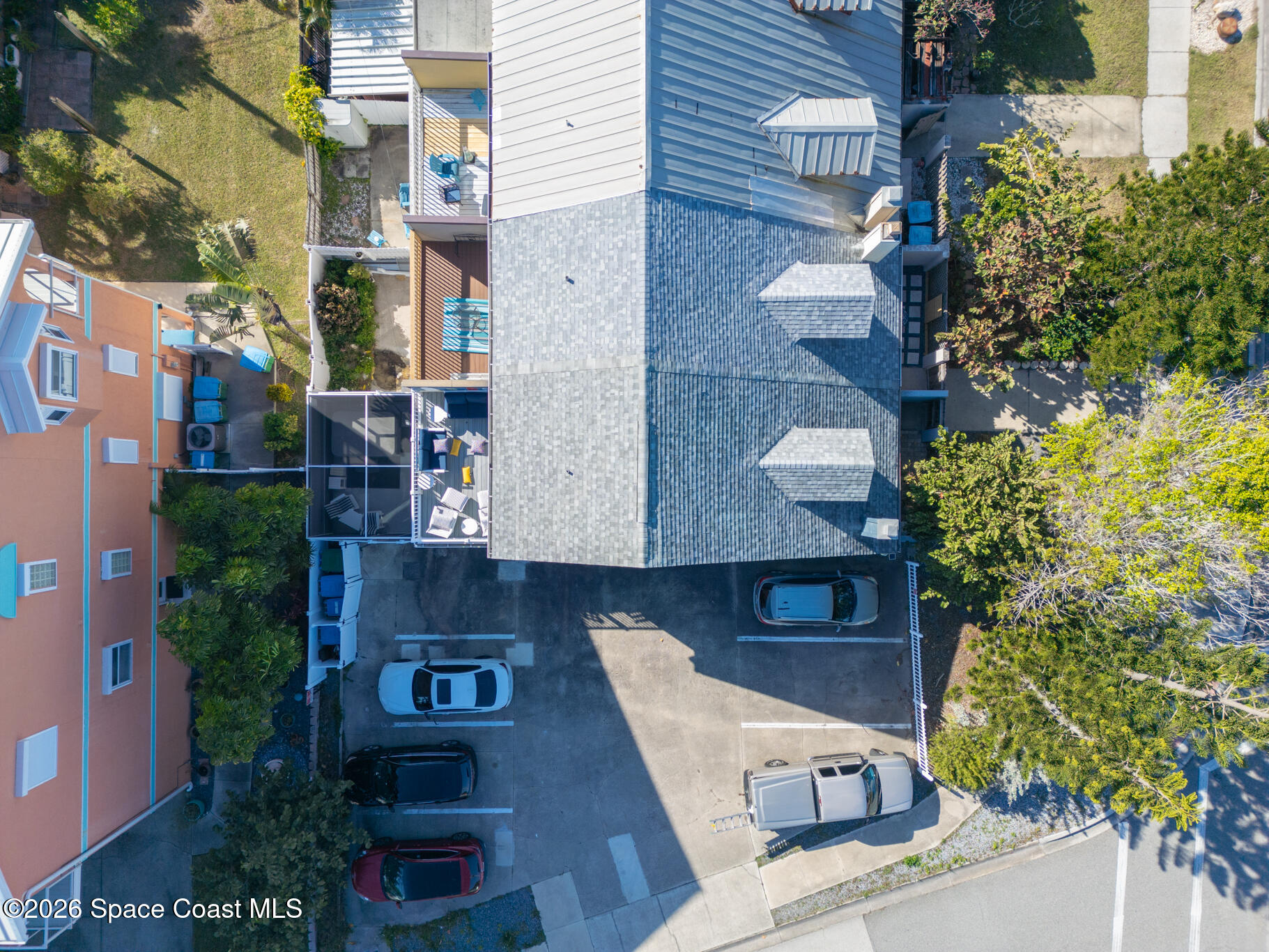 8156 Ridgewood Avenue Cape Canaveral, FL 32920 - Photo 38 of 53 an aerial view of a house with a yard and balcony
