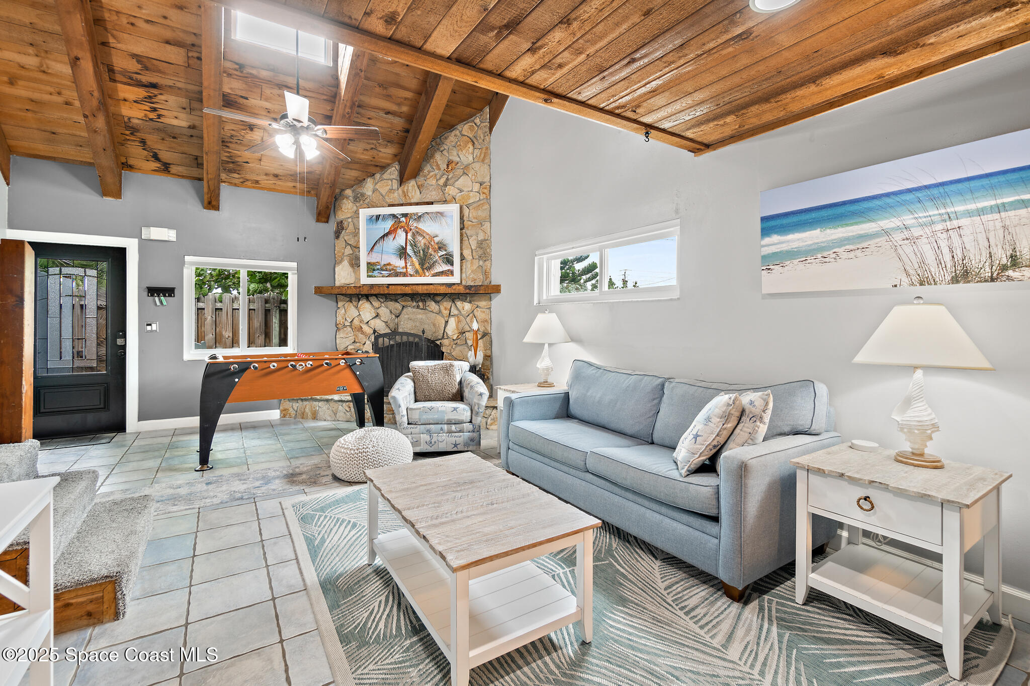 8156 Ridgewood Avenue Cape Canaveral, FL 32920 - Photo 4 of 53 a living room with furniture and a couch