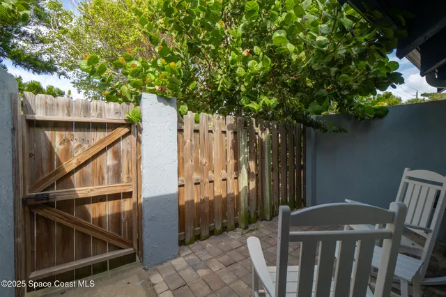 a view of a house with a tree