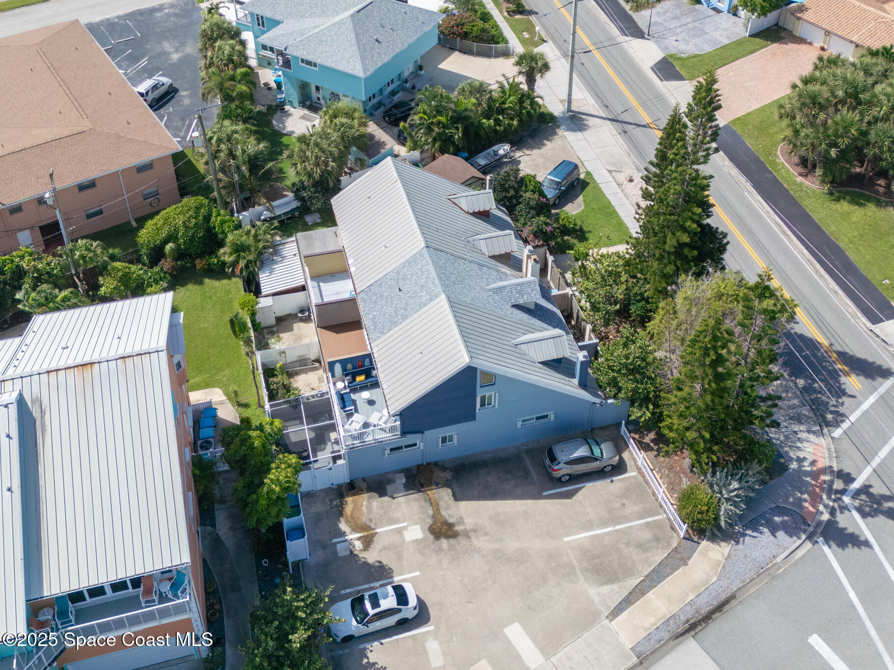 8156 Ridgewood Avenue Cape Canaveral, FL 32920 - Photo 47 of 53 an aerial view of a house with a yard