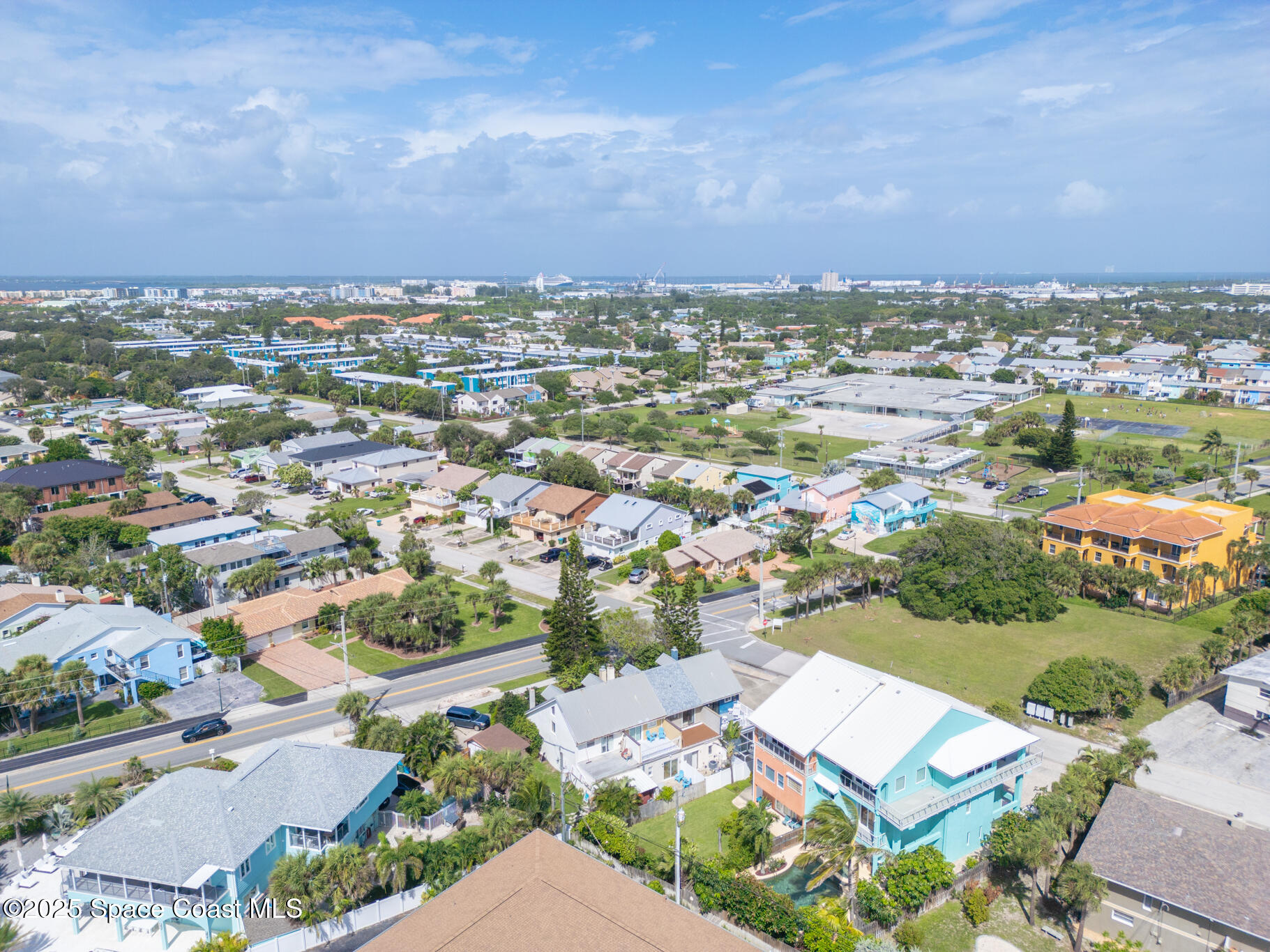 8156 Ridgewood Avenue Cape Canaveral, FL 32920 - Photo 48 of 53 an aerial view of a city with lots of residential buildings