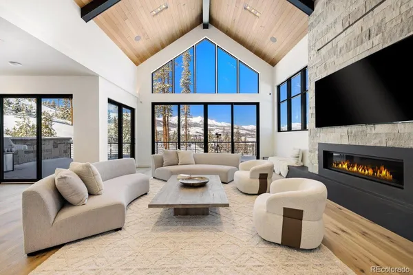 a living room with fireplace furniture and a flat screen tv