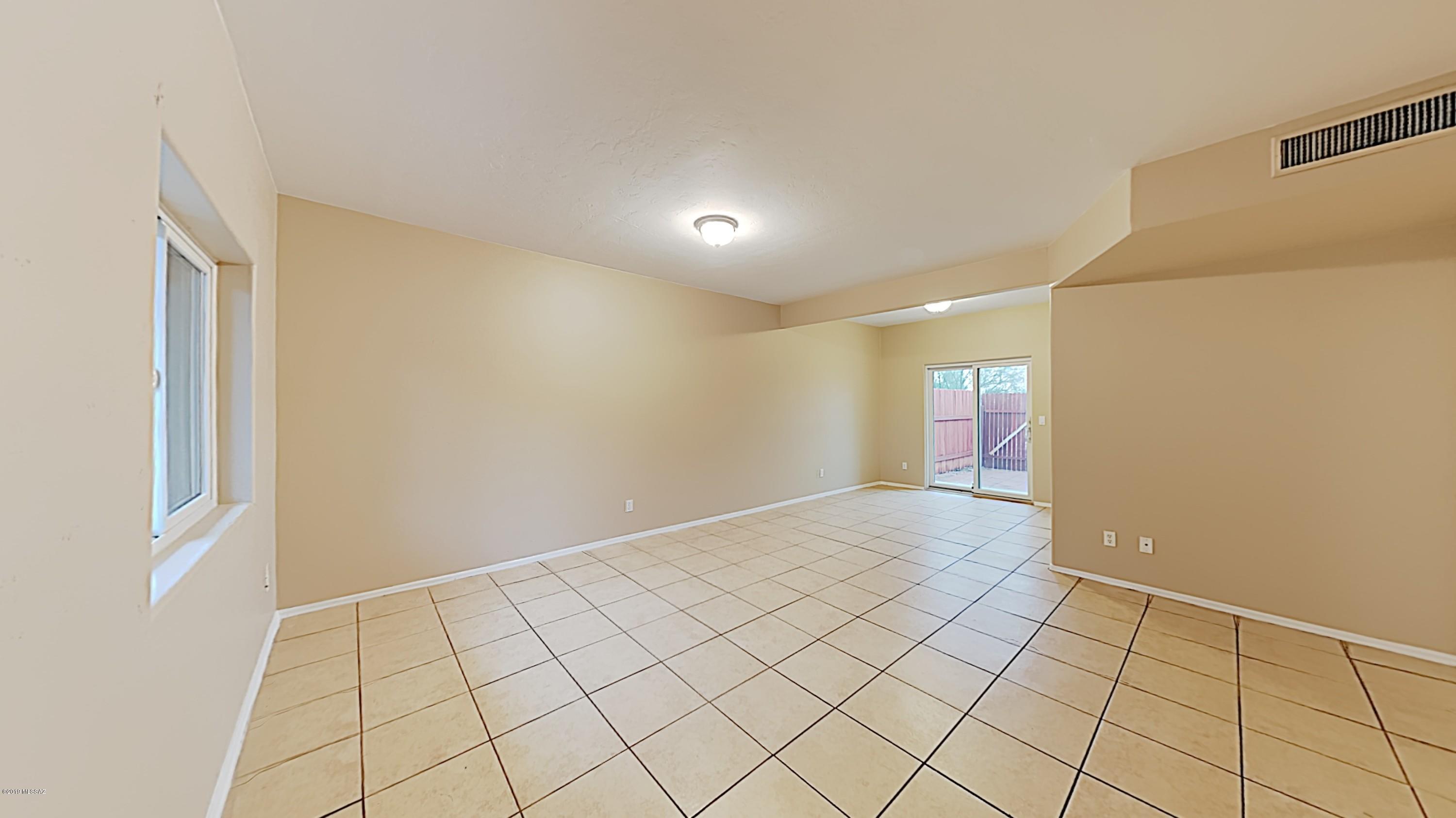 3516 South Mission Road, Unit 3 Tucson, AZ 85713 - Photo 5 of 19 a view of an empty room and window