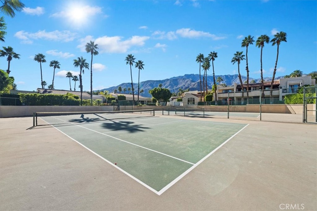 200 East Racquet Club Road, Unit 72 Palm Springs, CA 92262 - Photo 17 of 19 a view of a tennis court