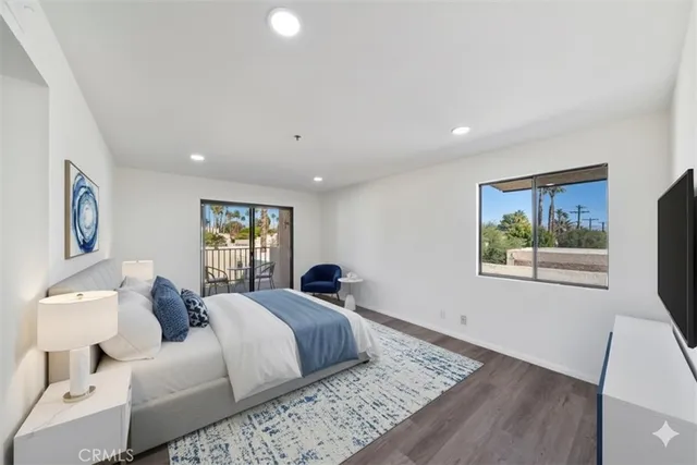 a bathroom with a tub a double vanity sink and mirror