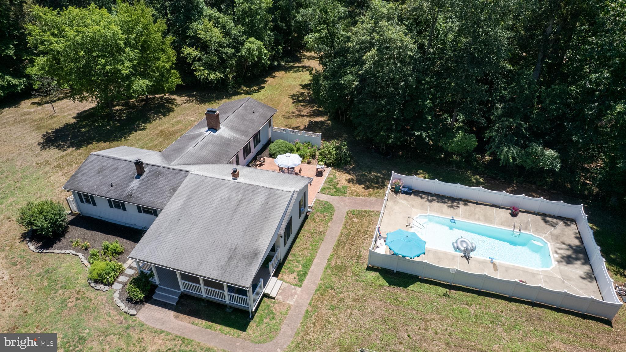 23130 Sparks Road Ridgely, MD 21660 - Photo 74 of 74 an aerial view of a house with swimming pool and a yard