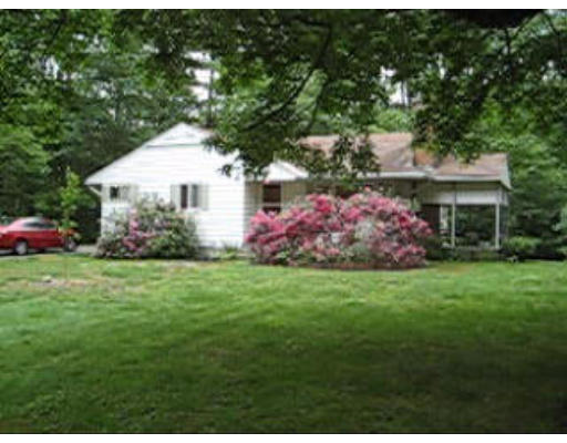 574 Ryan Road Northampton, MA 01062 - Photo 1 of 7 a front view of a house with a garden
