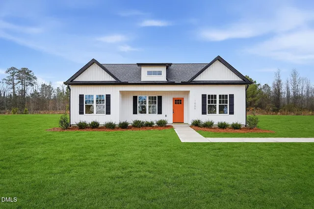 front view of a house with a yard
