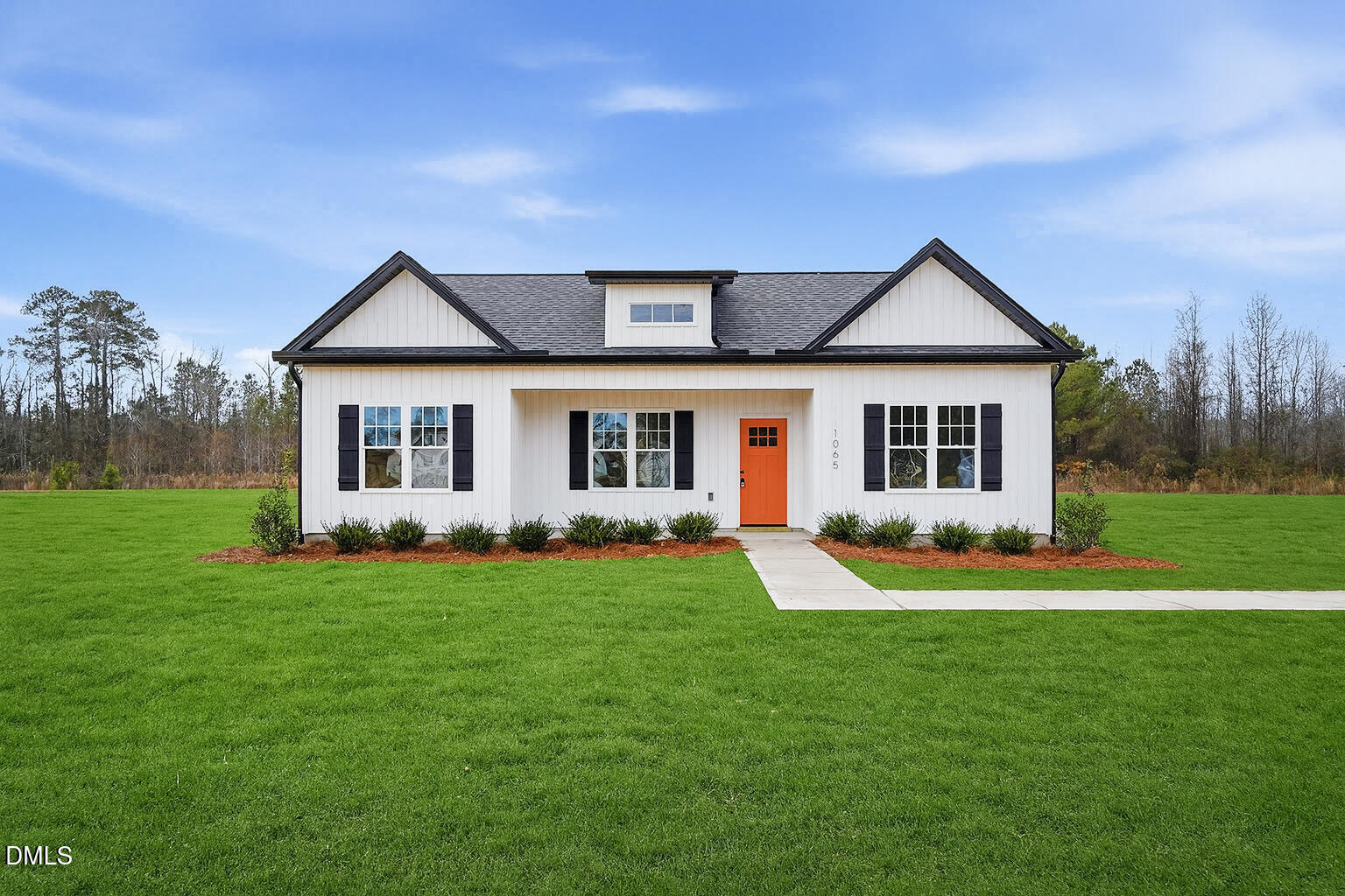 front view of a house with a yard