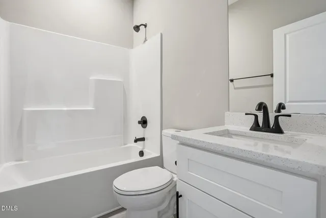 a bathroom with a sink a toilet and a bathtub