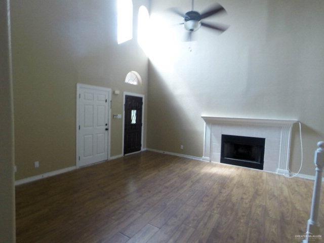 204 San Saba Street Mission, TX 78572 - Photo 2 of 15 an empty room with windows and fireplace