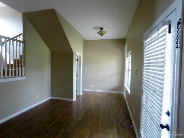 204 San Saba Street Mission, TX 78572 - Photo 6 of 15 a view of wooden floor and windows in a room