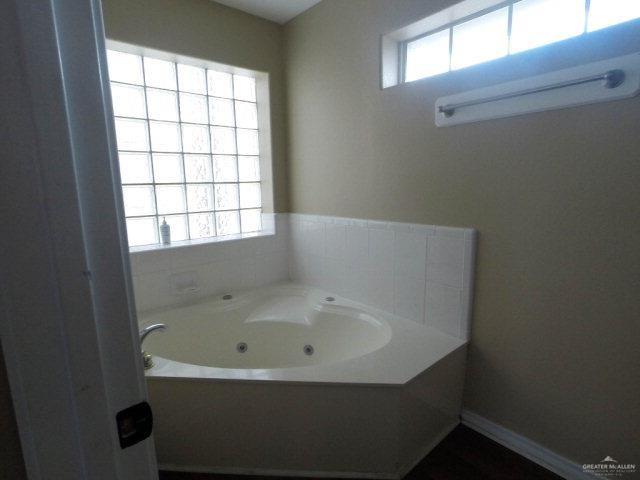 204 San Saba Street Mission, TX 78572 - Photo 9 of 15 a bathroom with a bathtub