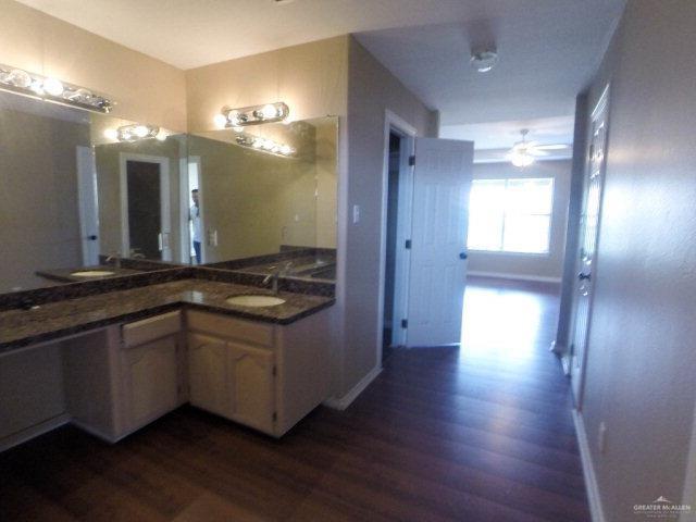 204 San Saba Street Mission, TX 78572 - Photo 10 of 15 a bathroom with a sink and a large mirror