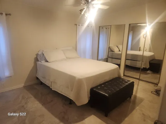 a room with a bed and a view of bathroom