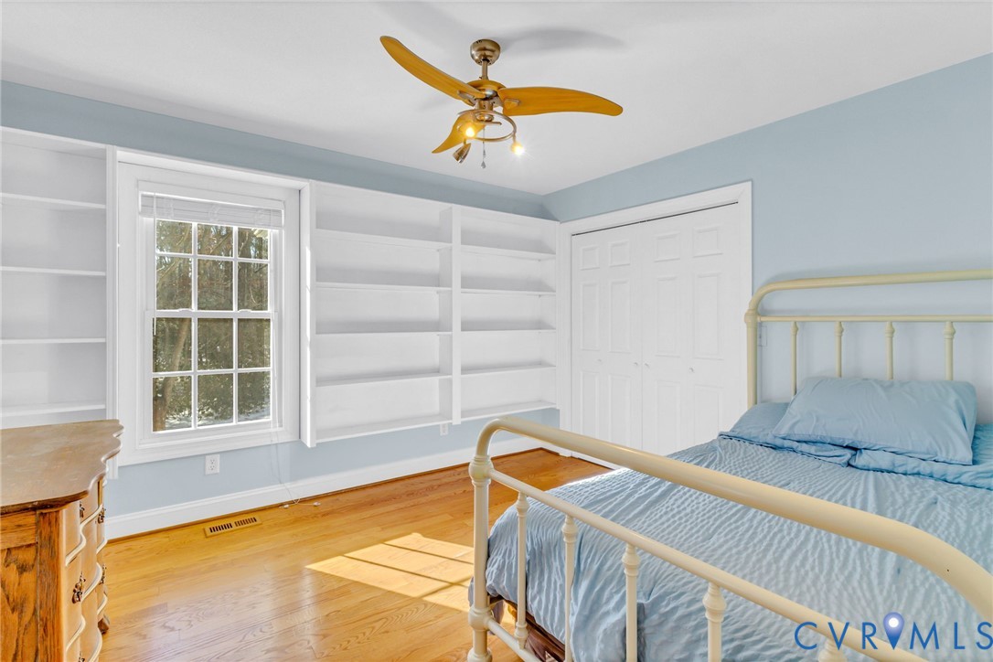 43 Ruddy Duck Road Heathsville, VA 22473 - Photo 13 of 46 a bedroom with a bed and a window