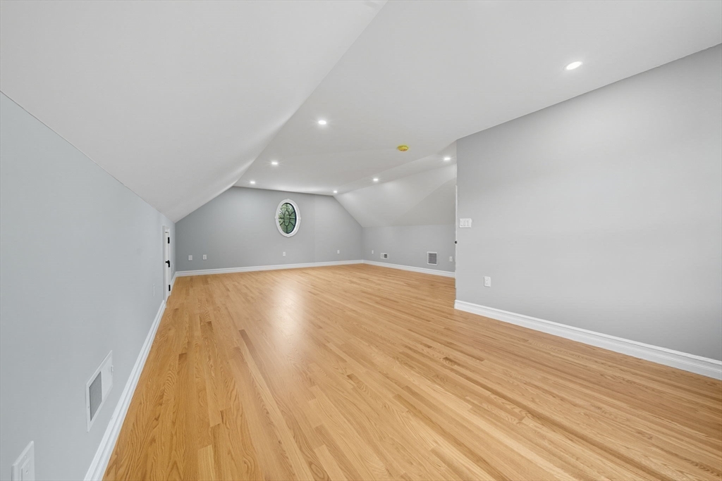 185 Lexington Street Woburn, MA 01801 - Photo 29 of 39 an empty room with wooden floor and windows