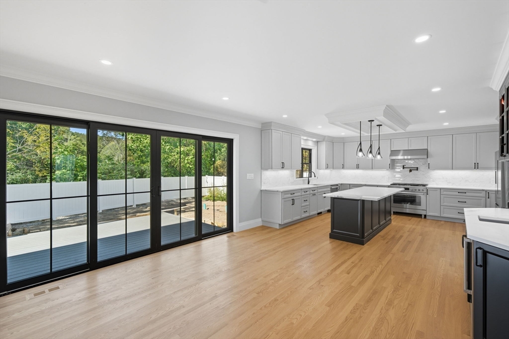 185 Lexington Street Woburn, MA 01801 - Photo 3 of 39 a large kitchen with a large window and stainless steel appliances