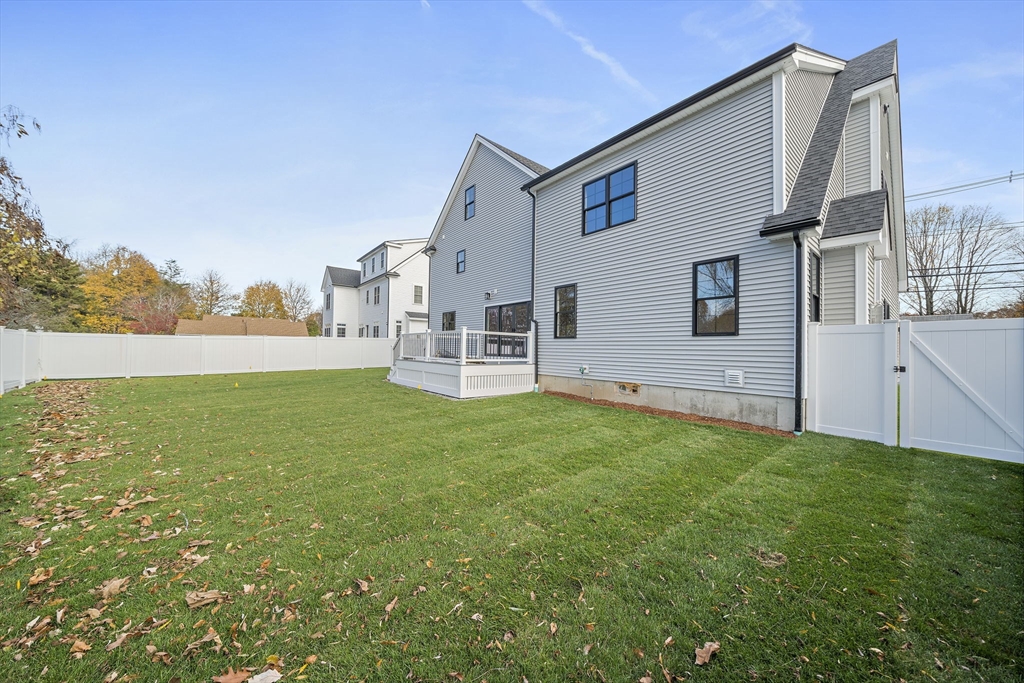 185 Lexington Street Woburn, MA 01801 - Photo 37 of 39 a view of front of house with yard