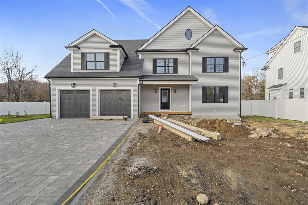 185 Lexington Street Woburn, MA 01801 - Photo 39 of 39 front view of a house with a yard