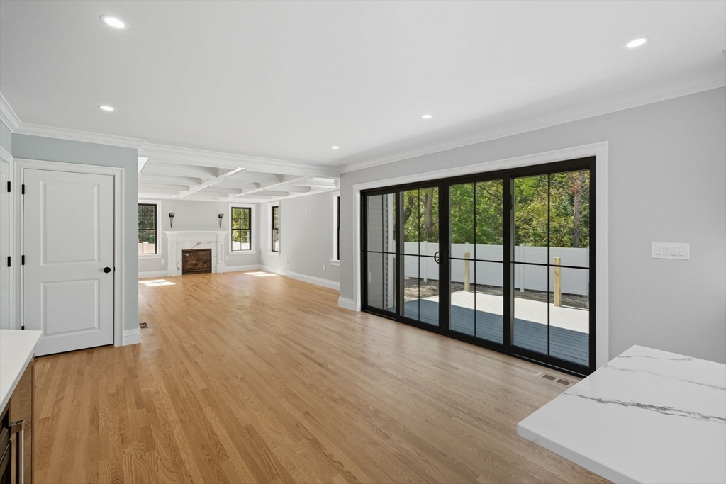 185 Lexington Street Woburn, MA 01801 - Photo 9 of 39 a view of empty room with wooden floor and fan