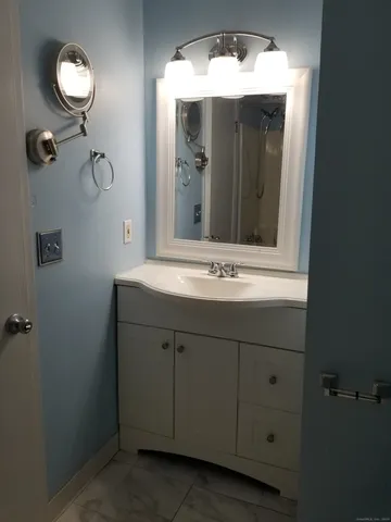 a view of wooden floor and a window