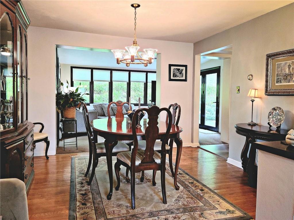 5184 Richland Road Gibsonia, PA 15044 - Photo 6 of 23 a view of a dining room with furniture window and wooden floor
