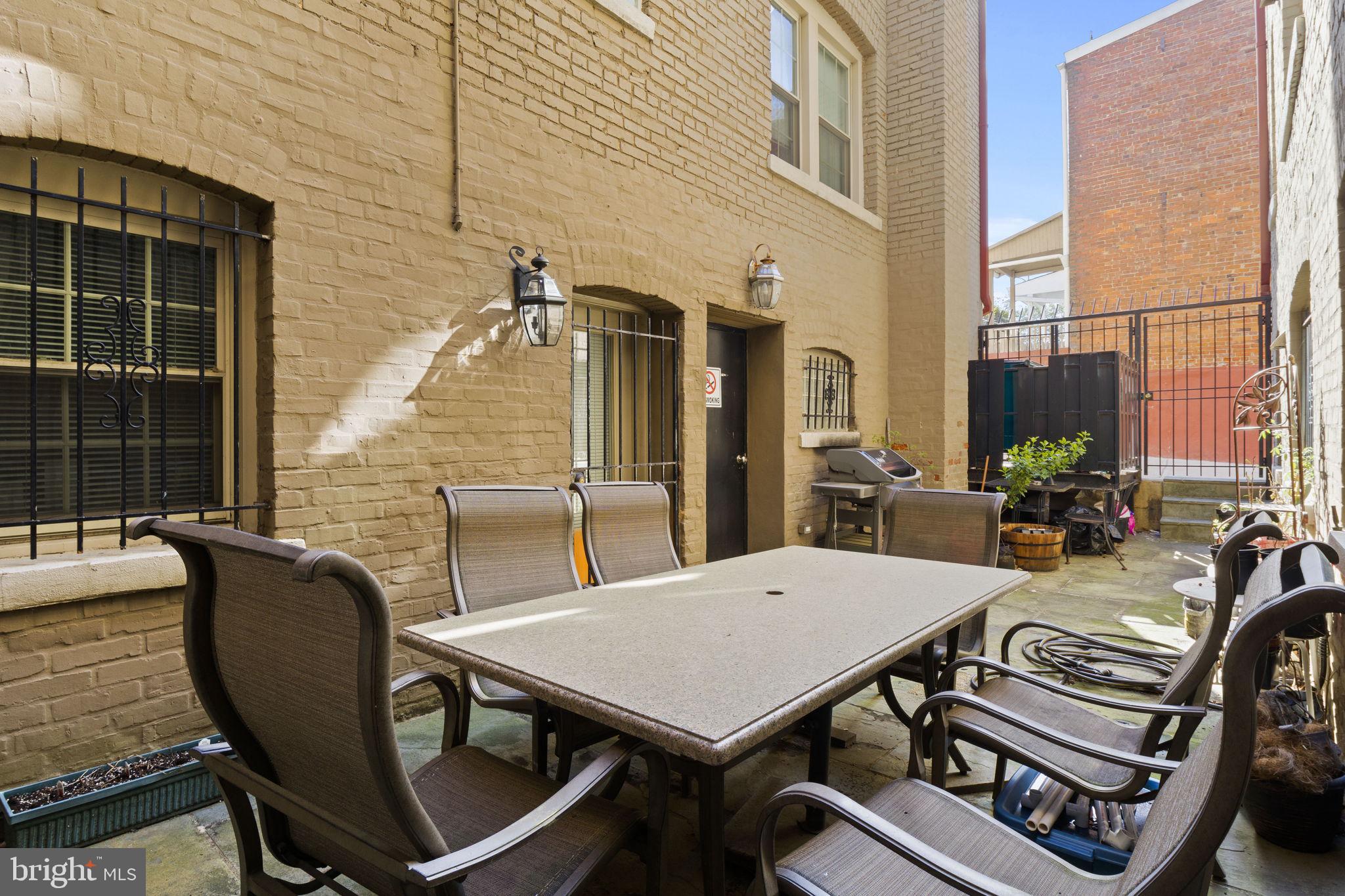 410 15th Street Northeast, Unit 22 Washington, DC 20002 - Photo 18 of 27 a view of a patio with a table and chairs