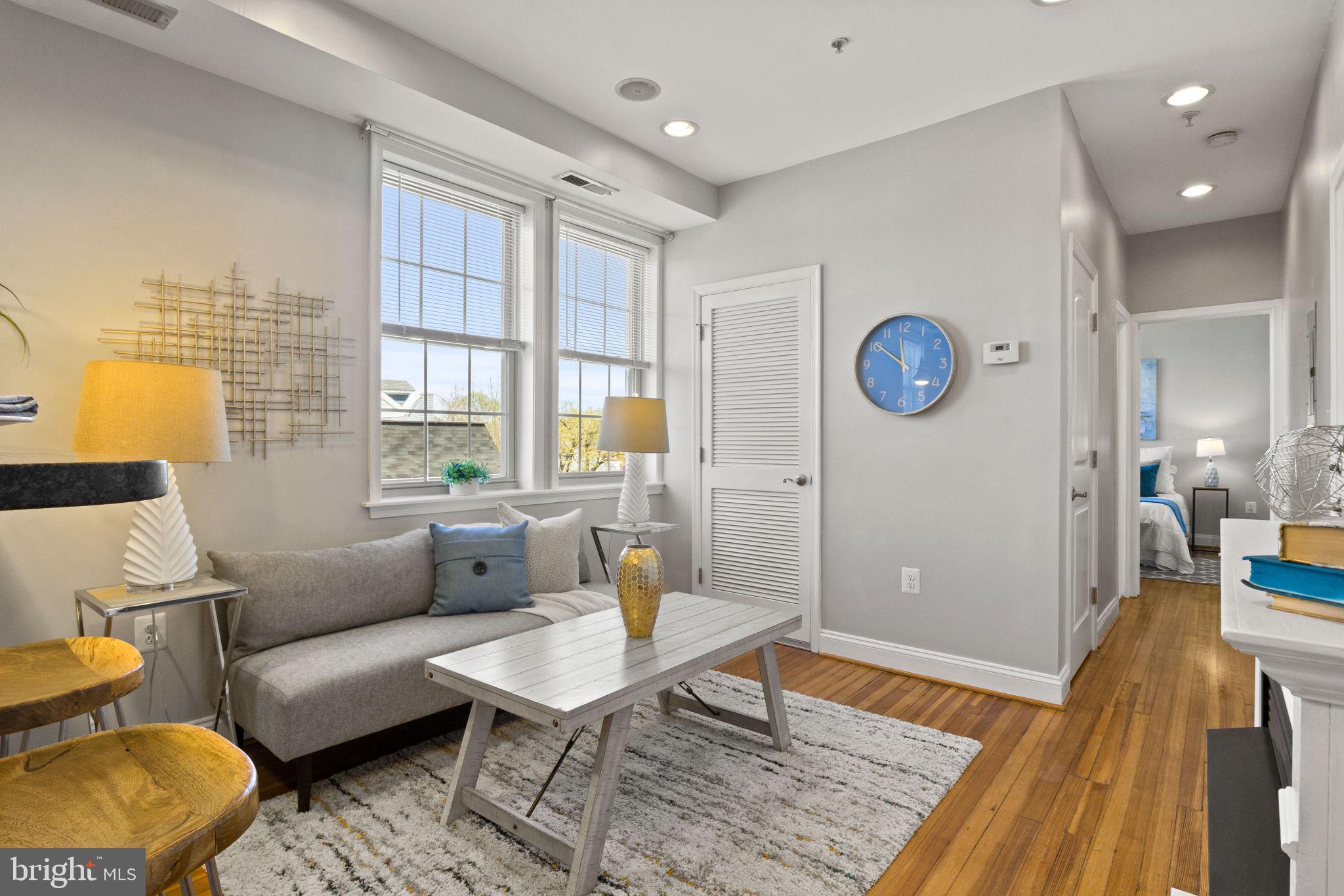 410 15th Street Northeast, Unit 22 Washington, DC 20002 - Photo 2 of 27 a living room with furniture and a table