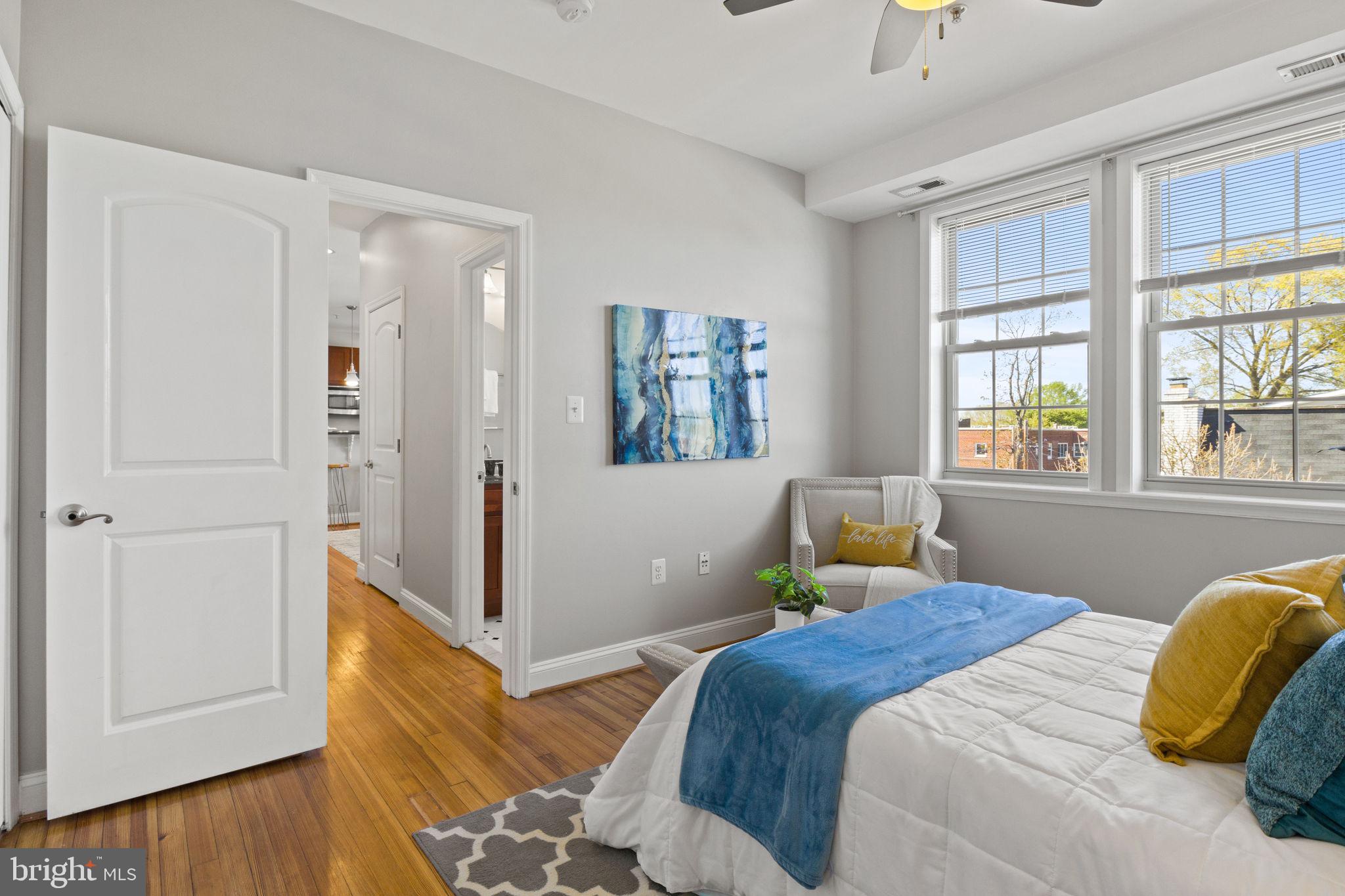 410 15th Street Northeast, Unit 22 Washington, DC 20002 - Photo 8 of 27 a bedroom with a bed and wooden floor