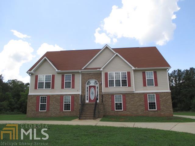 2194 South Ola Road Locust Grove, GA 30248 - Photo 1 of 1 a front view of a house with a yard
