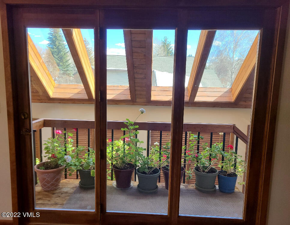 753 Bull Run Eagle, CO 81631 - Photo 12 of 30 a view of a dining room with furniture window and garden view