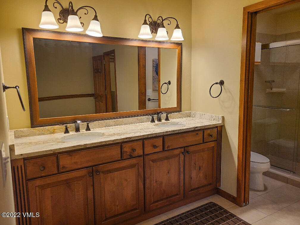 753 Bull Run Eagle, CO 81631 - Photo 14 of 30 a bathroom with a sink and a mirror
