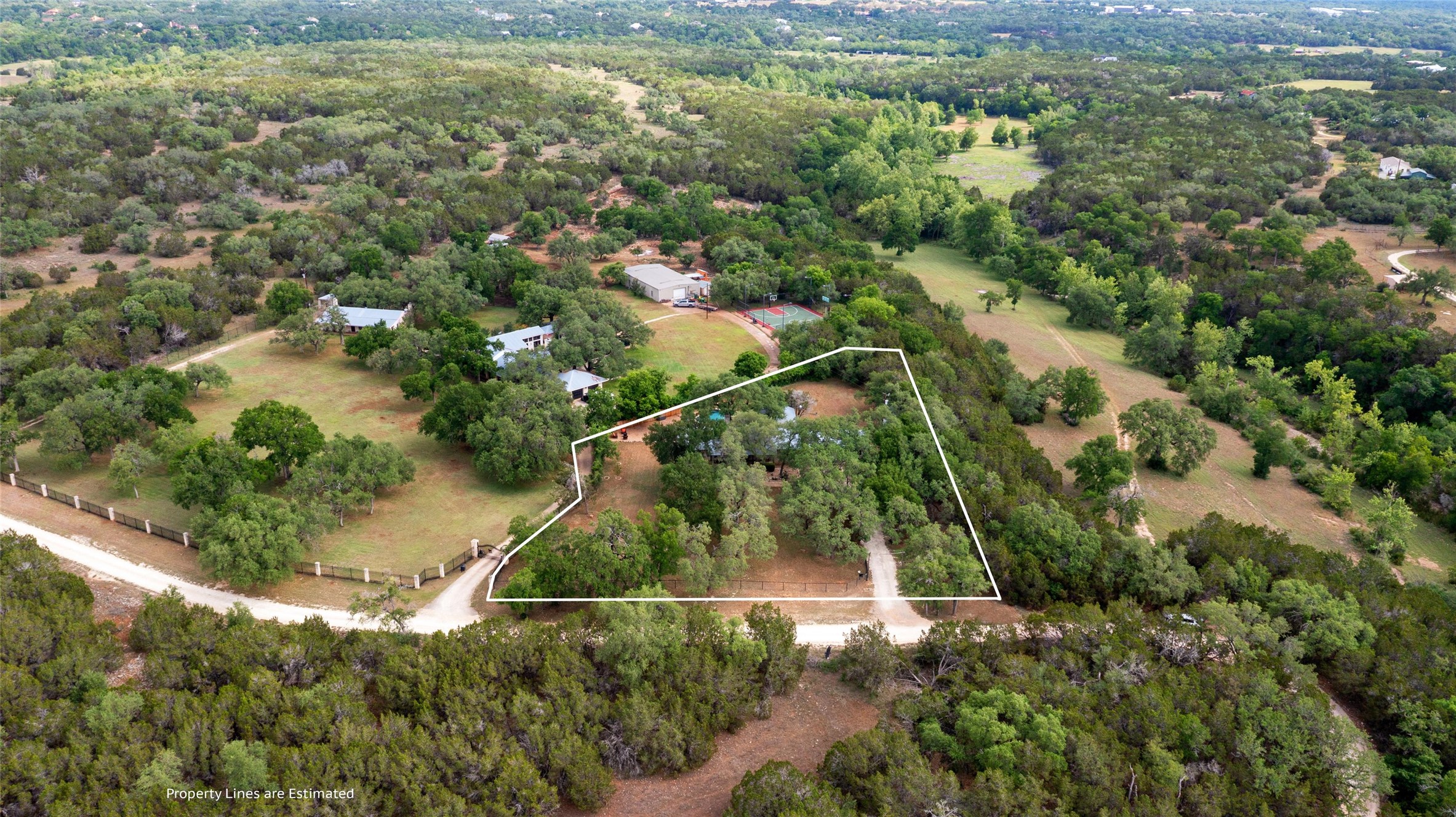 720 Circle G Ranch Road Austin, TX 78737 - Photo 4 of 37 an aerial view of residential houses with outdoor space and trees
