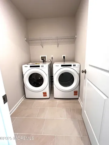 a view of a kitchen with a washer and dryer