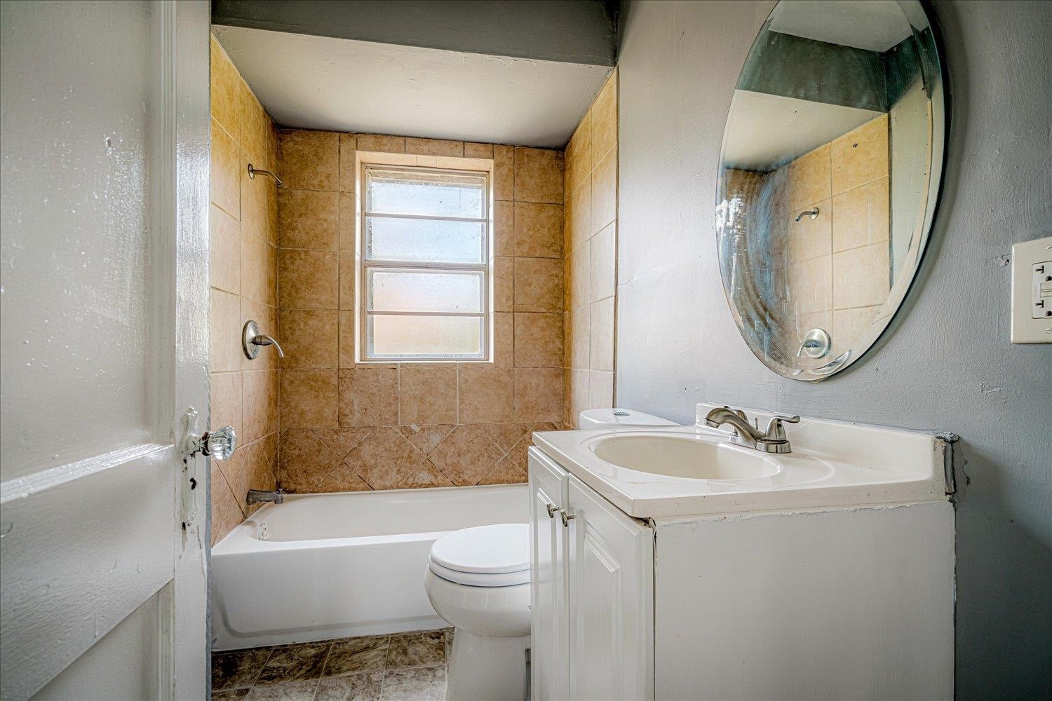 1114 Brownlee Road Memphis, TN 38116 - Photo 22 of 32 a bathroom with a sink toilet and shower