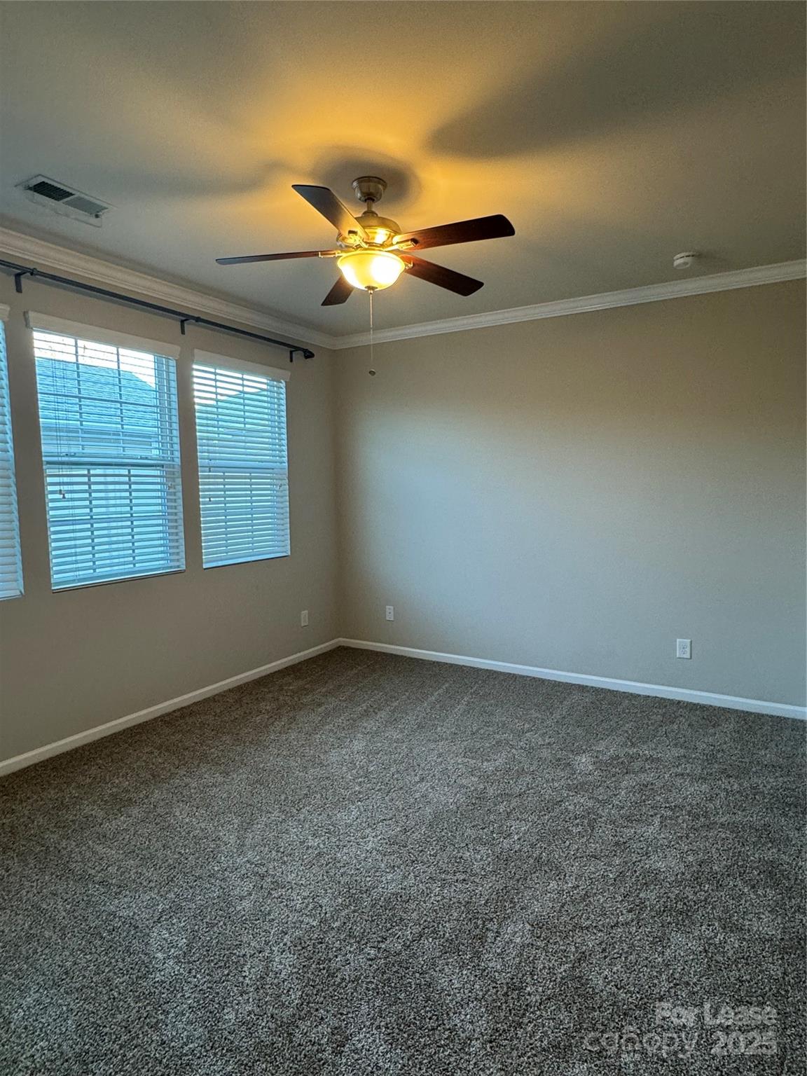 18431 The Commons Boulevard Cornelius, NC 28031 - Photo 11 of 24 an empty room with windows