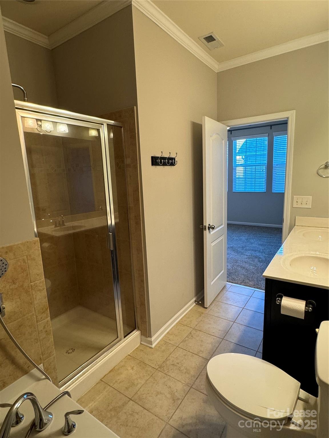 18431 The Commons Boulevard Cornelius, NC 28031 - Photo 13 of 24 a bathroom with a sink and a mirror