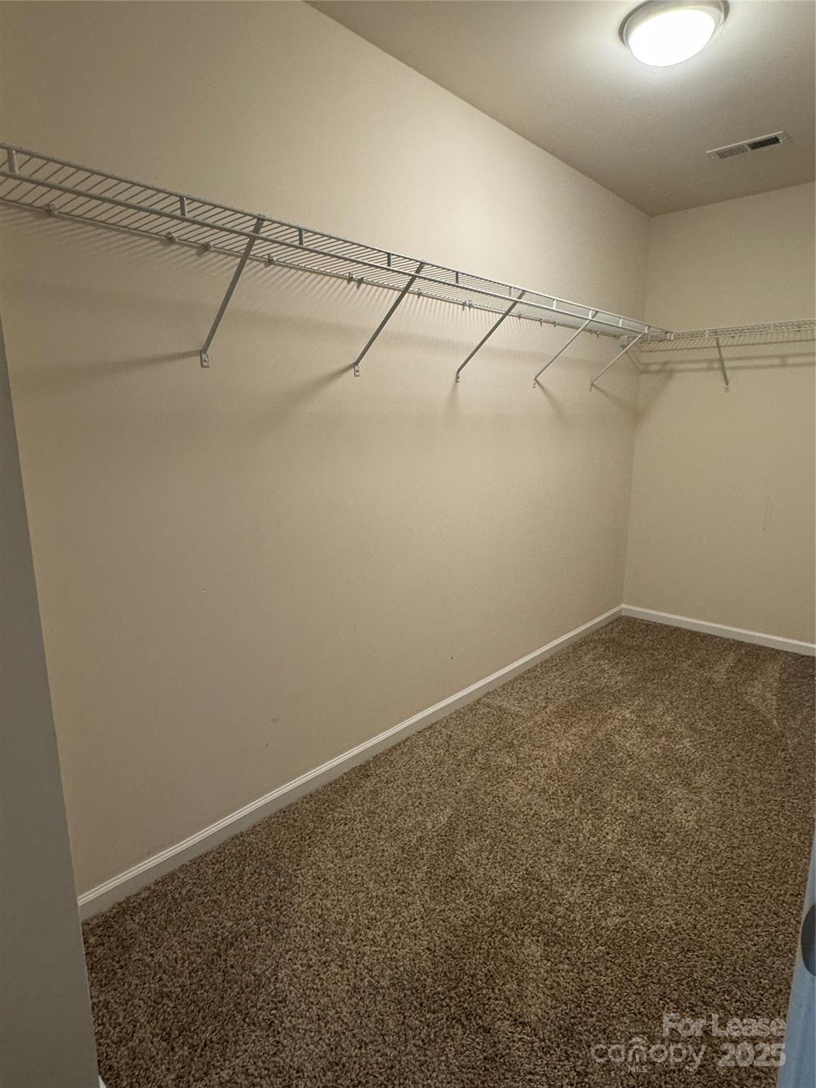 18431 The Commons Boulevard Cornelius, NC 28031 - Photo 14 of 24 a view of a room with racks on the wall