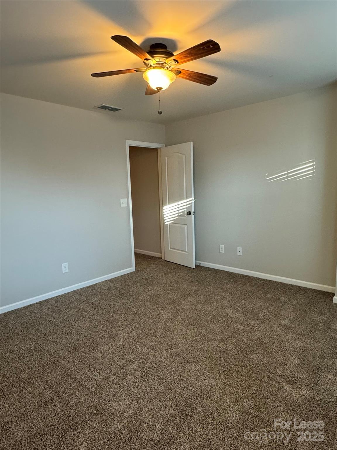 18431 The Commons Boulevard Cornelius, NC 28031 - Photo 20 of 24 a view of a ceiling fan in a room